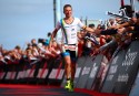 PEMBROKE, WALES - SEPTEMBER 13: Markus Thomschke of Germany celebrates as he crosses the line to come third during Ironman Wales on September 13, 2015 in Pembroke, Wales. (Photo by Jordan Mansfield/Getty Images for Ironman)