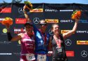 KRAICHGAU, GERMANY - JUNE 11: Winner Laura Philipp, second place Yvonne van Vlerken (L) and third place Lena Berlinger celebrate after Ironman 70.3 Kraichgau on June 11, 2017 in Kraichgau, Germany. (Photo by Joern Pollex/Getty Images)