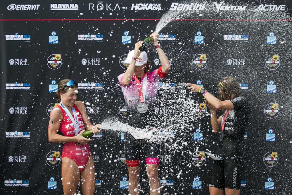 NICE, FRANCE - SEPTEMBER 07: (L-R) Holly Lawrence of Great Britain, Daniela Ryf of Switzerland and Imogen Simmonds of Switzerland celebrate on the podium during the flower ceremony of the IRONMAN 70.3 Worldchampionship in Nice on September 07, 2019 in Nice, France. (Photo by Jan Hetfleisch/Getty Images for IRONMAN)